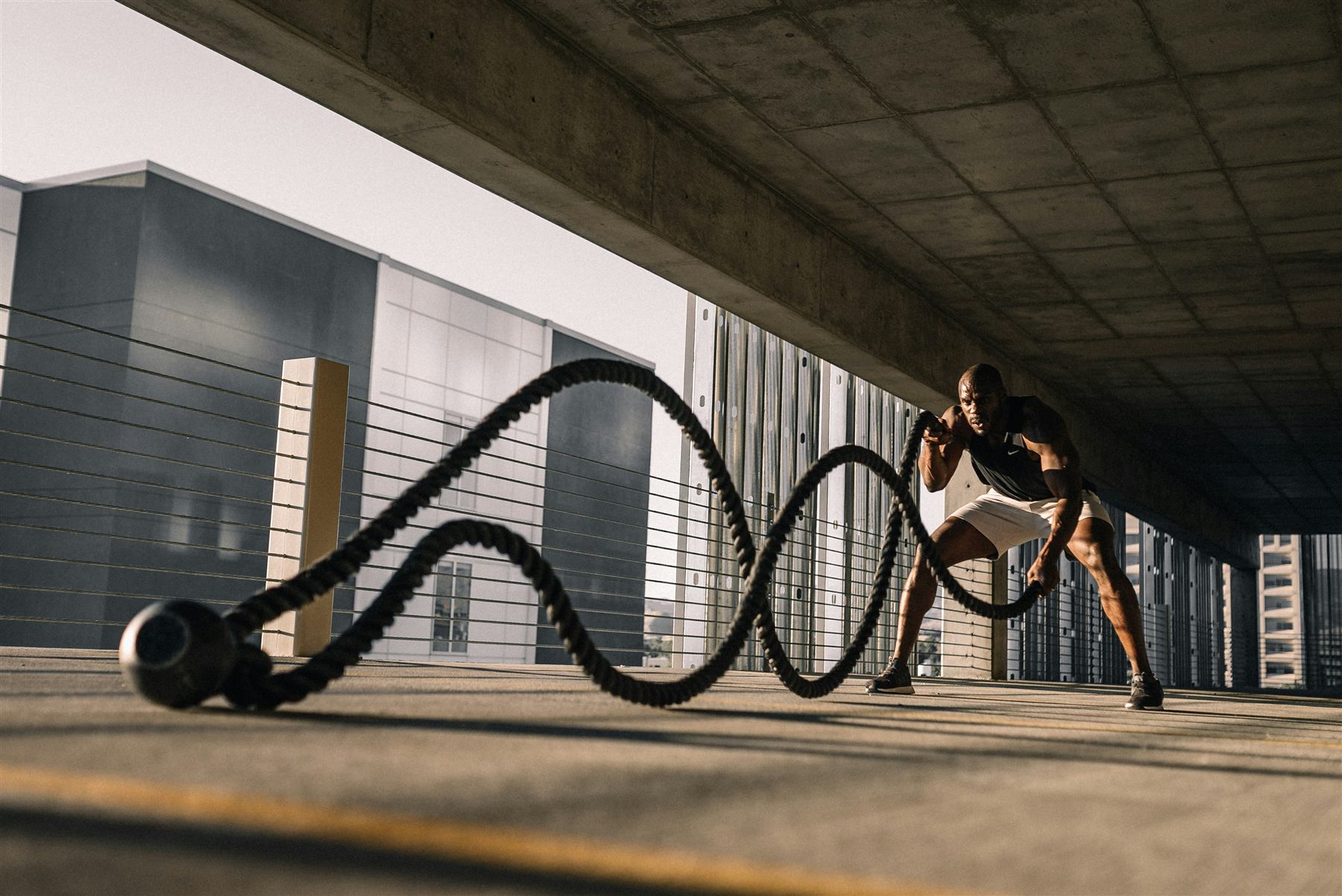 Coach training with battle ropes at Chaos Fitness, Tifton GA