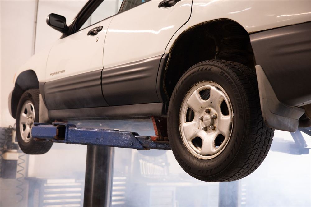 Vehicle raised on an alignment lift