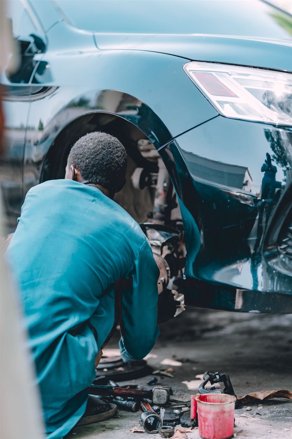 Mechanic inspecting a brake assembly