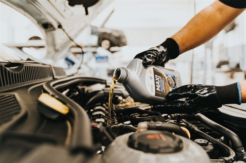 Mechanic performing an oil change
