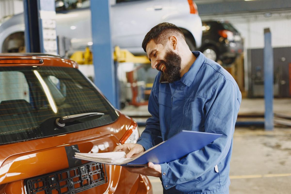Service advisor reviewing a vehicle inspection with a customer at K Auto Repair