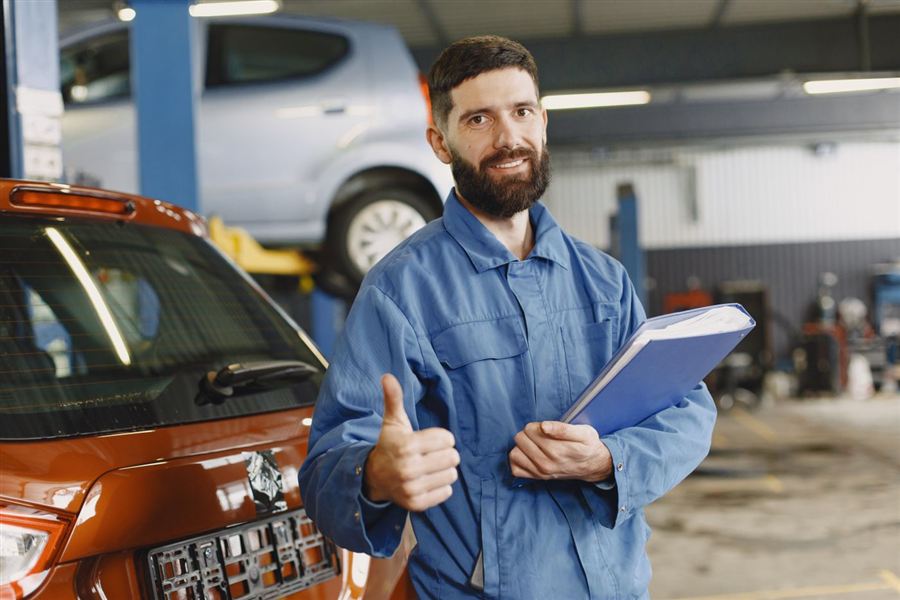 Technician giving a thumbs up after completing a repair
